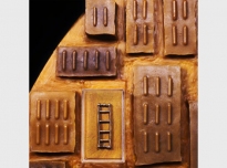 Ghana I (detail), 1995, Asante gold weights, Ghana (Brighton Royal Pavilion & Museums, World Art Collection), African beeswax on board, 165cm diameter