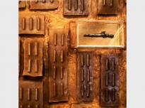 Ghana I (detail), 1995, Asante gold weights, Ghana (Brighton Royal Pavilion & Museums, World Art Collection), African beeswax on board, 165cm diameter